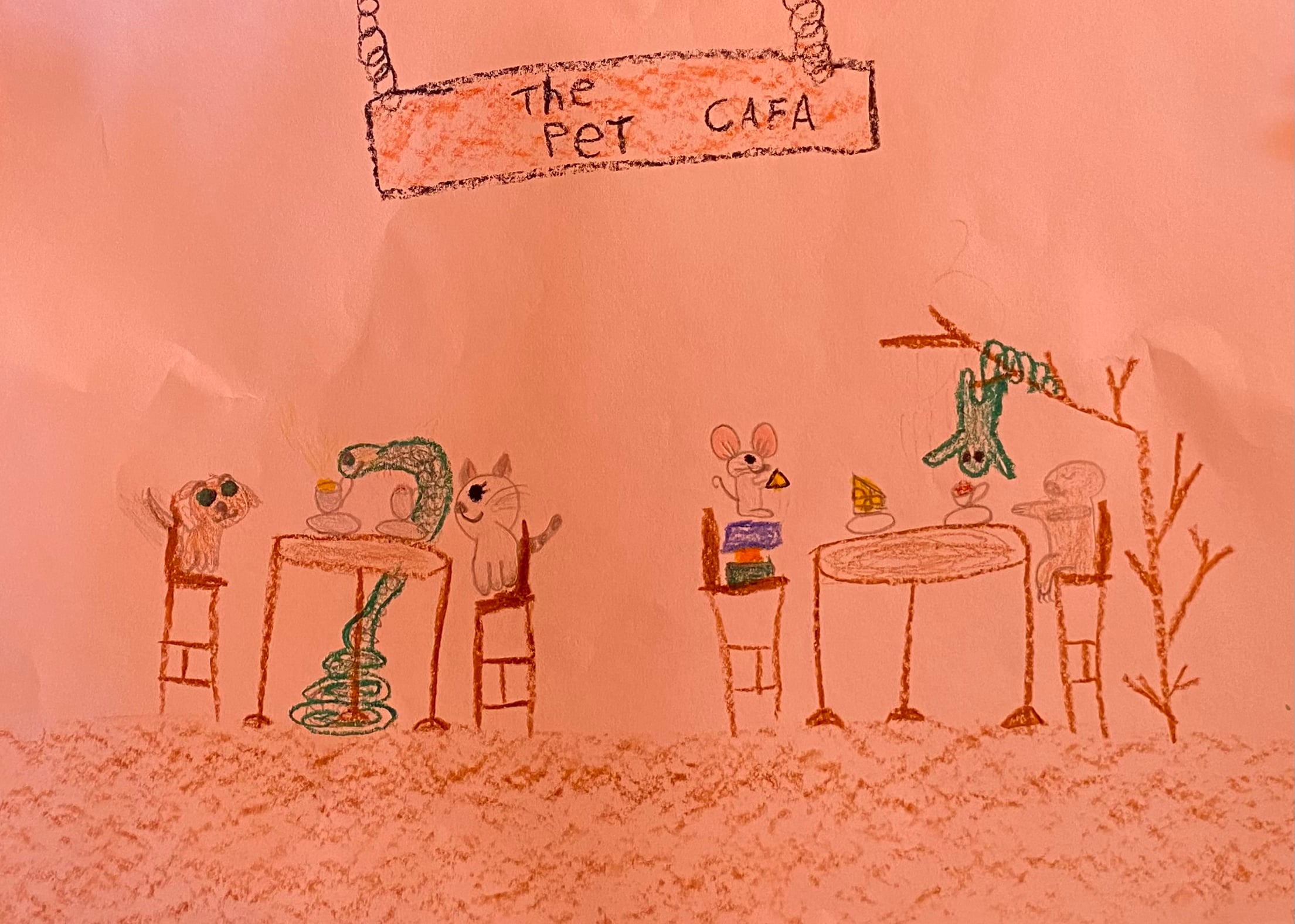 Drawing by a second-grade student of animals seated at tables beneath a pet cafe sign